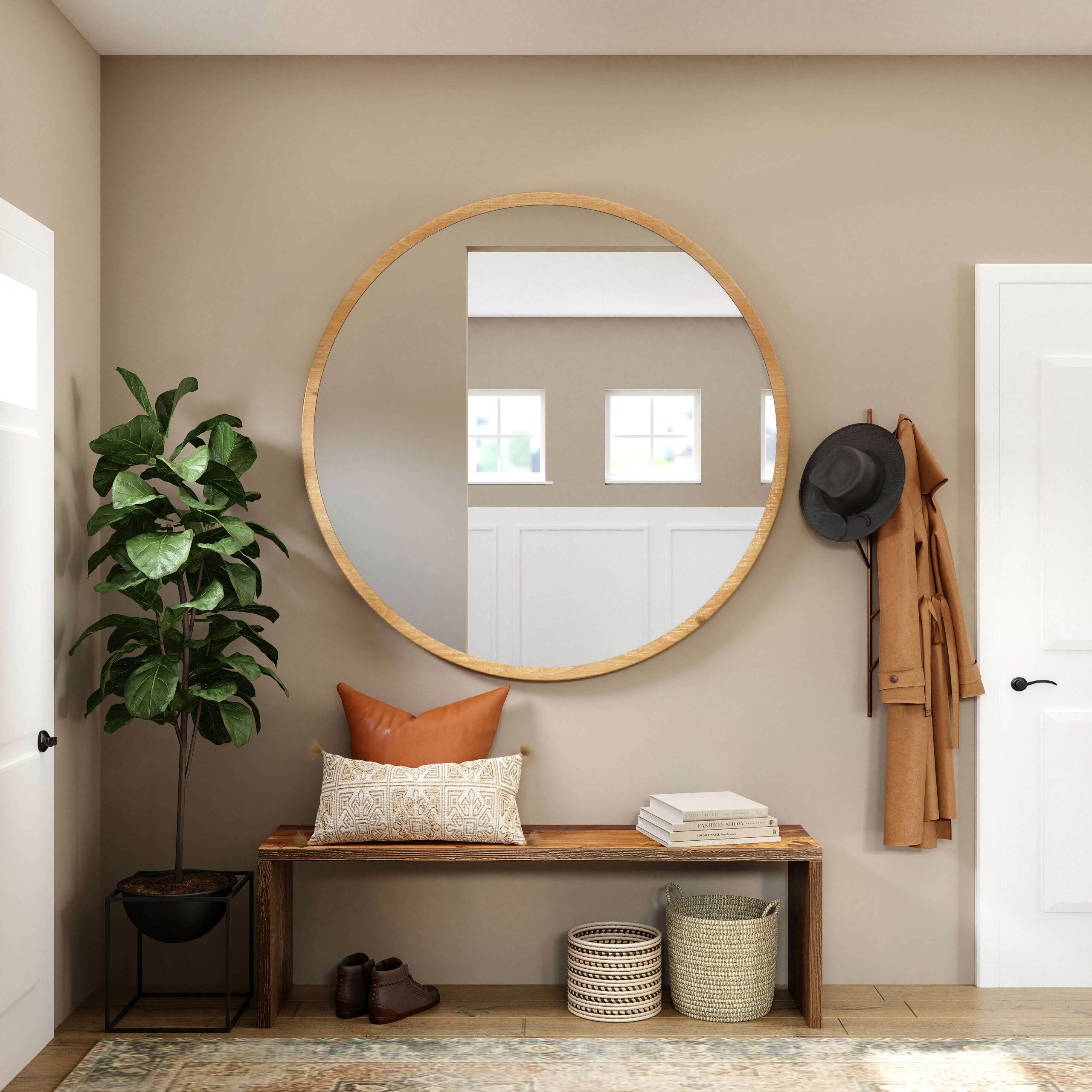 Large mirror in an entry to reflect natural light without making the wall feel cluttered.